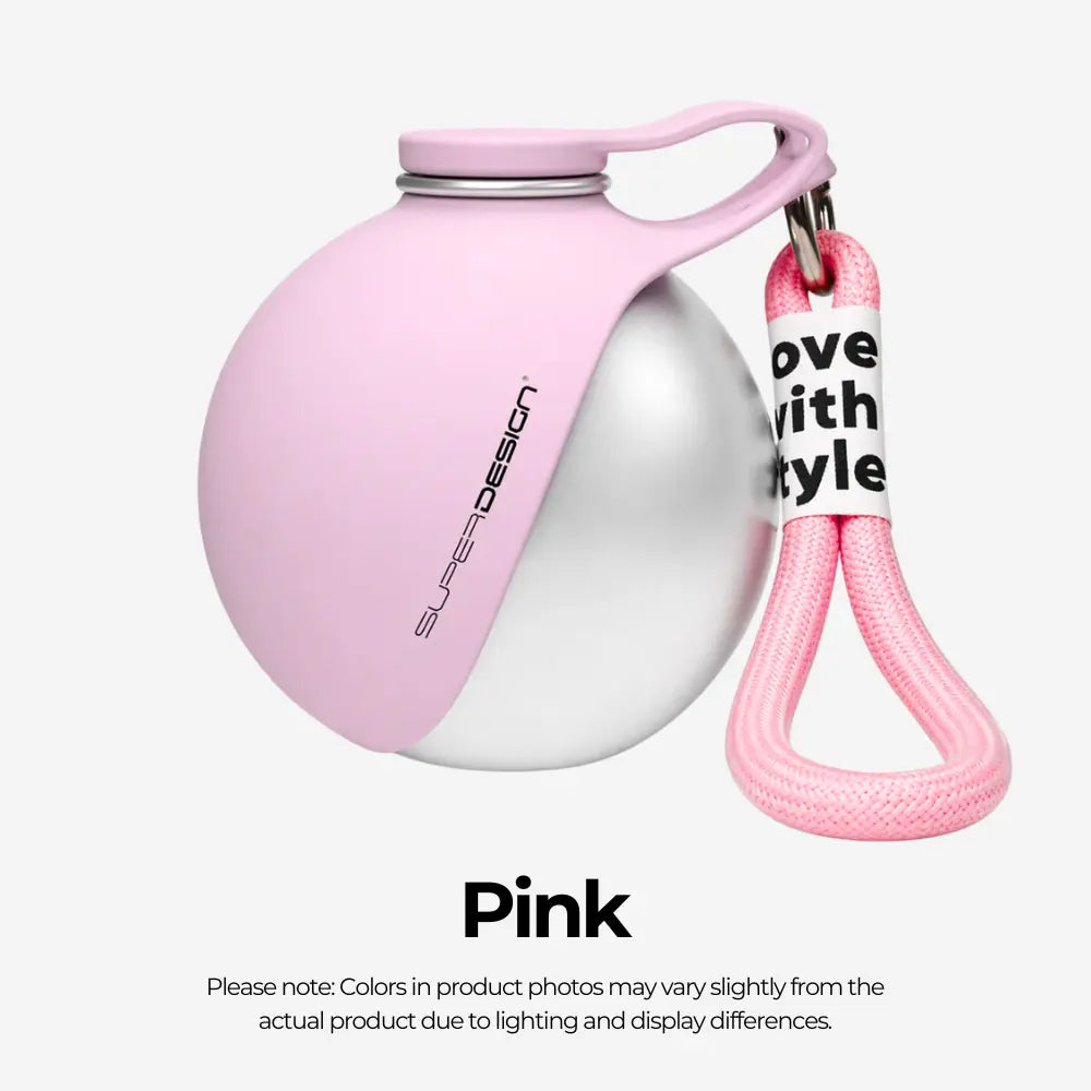 Pink and silver ball with a keychain on a white background