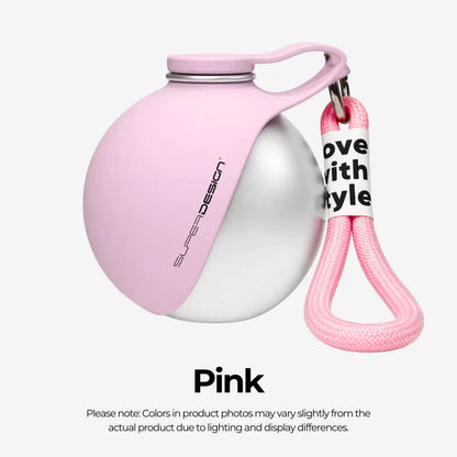 Pink and silver ball with a keychain on a white background